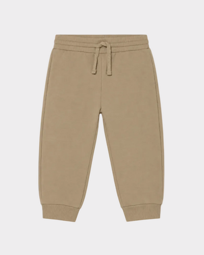 Baby jogger pants in beige with elastic waistband, adjustable drawstring, and ribbed cuffs. Available in sizes 0-3M, 3-6M, 6-9M, and 9-12M.