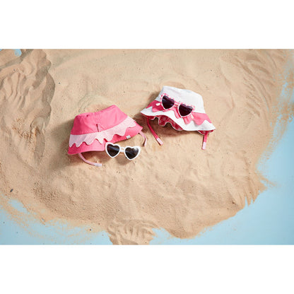 The Pink Hat & Sunglasses set includes two ruffled-brim sun hats with UPF 50+ protection in pink and pink/white, plus UV400 heart-shaped sunglasses. Sizes available: One size fits most.