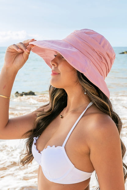 Tie-back Bucket Sunhat featuring adjustable tie-back design for a secure fit and wide brim for sun protection. Available in sizes S, M, L.
