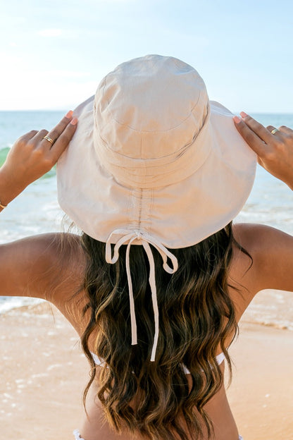 Tie-back Bucket Sunhat: Wide-brim sunhat with adjustable back tie. Sizes available: S, M, L.