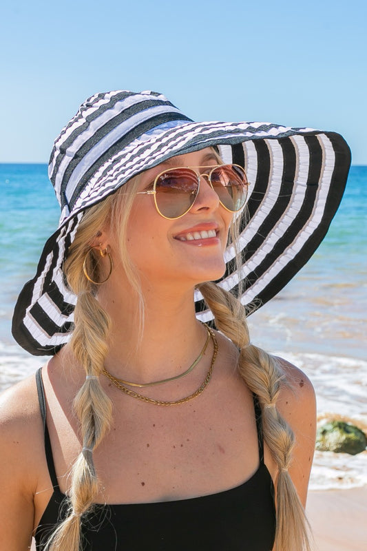 Stripe Bow Accent Sunhat: Wide-brim, striped sunhat with a bow accent. Sizes available: S, M, L.