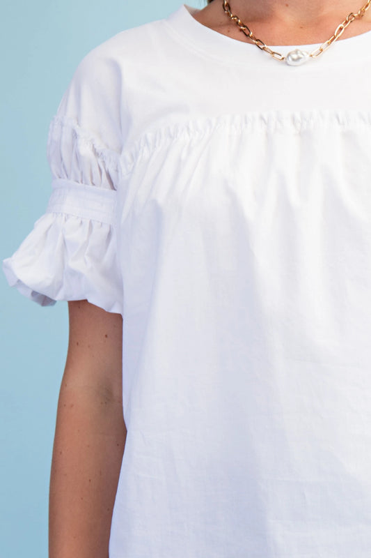 White Mixed Fabric Puff Sleeve Top with ruffled sleeves and chest. Available in XS, S, M, L, XL.