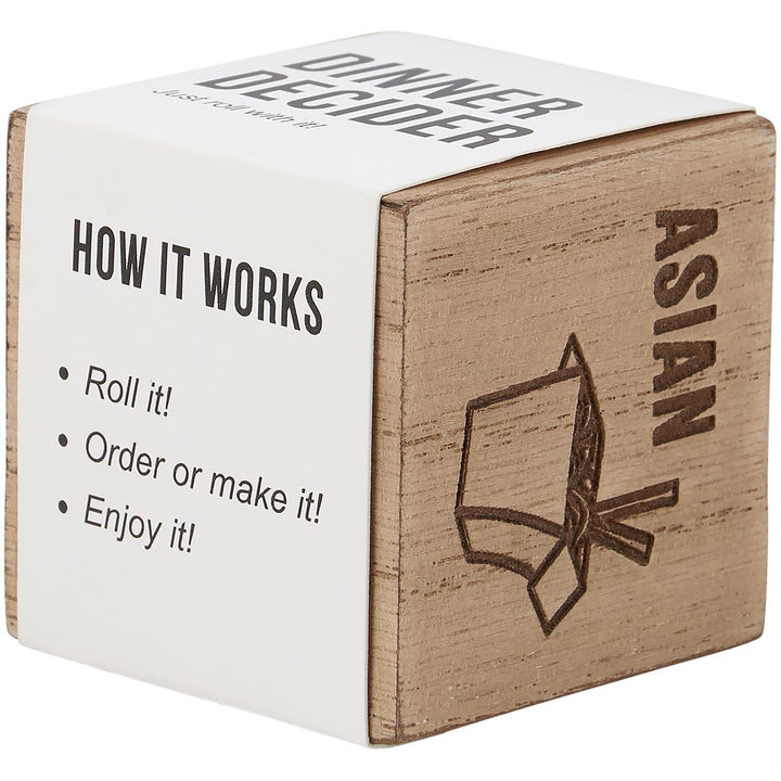 The Dinner Decision Dice is a wooden cube featuring engravings like "Dinner Decider" and "Asian," with a takeout box illustration. Roll it to choose your meal option. Sizes available: One size only.