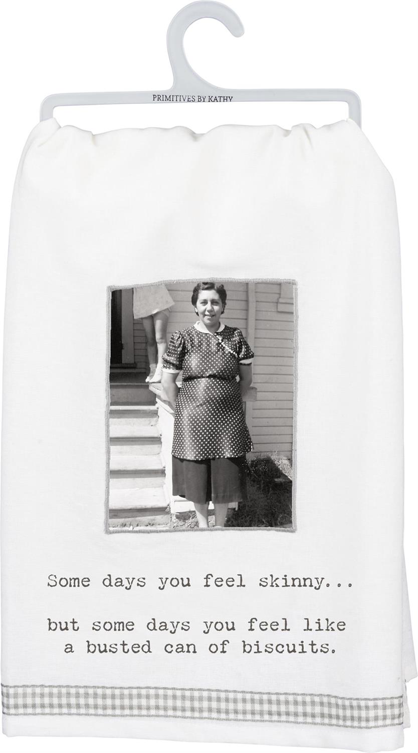 Black and white kitchen towel with humorous phrase, includes plastic hanger. Available sizes: 16"x28", 18"x30".