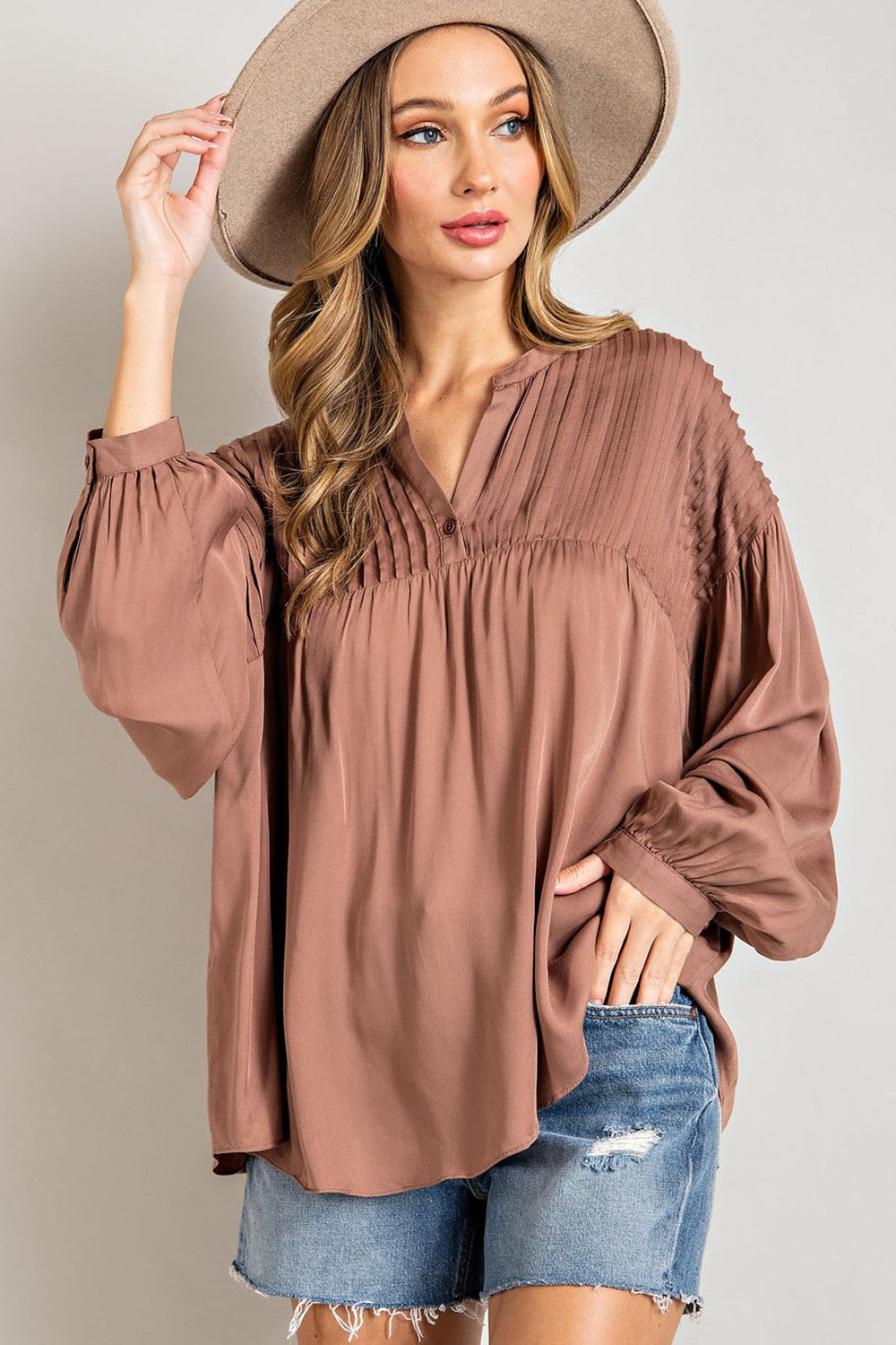 Pleated V-Neck Puff Sleeve Top in coco brown; available in sizes XS-XL.