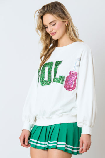 Golf Sweatshirt with green glittery letters and pink glittery bottle graphic. Available in sizes XS–XL.