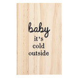 Rectangular light wood ceramic ornament reading “Baby’s First Christmas” and “baby it’s cold outside.”.