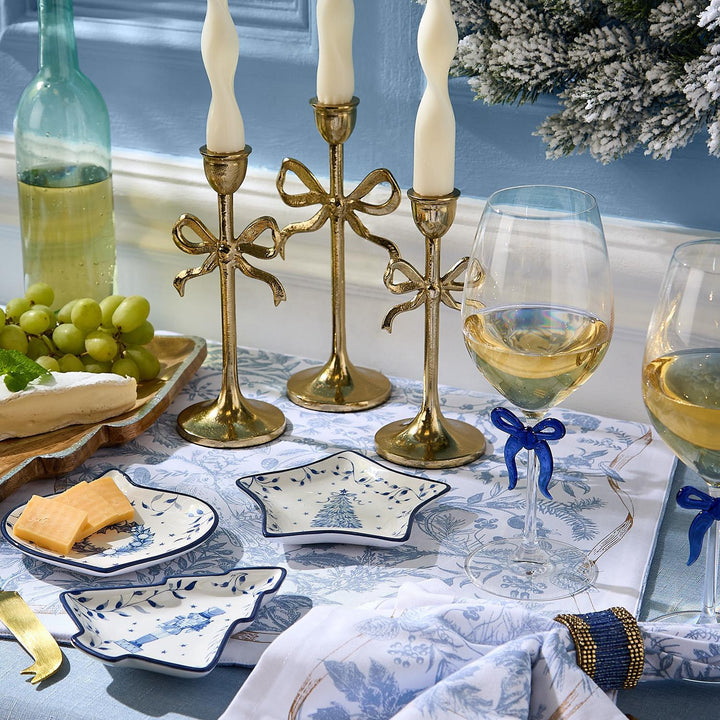 Three Season’s Gala star-shaped blue-and-white Christmas tidbit dish with festive winter illustrations.