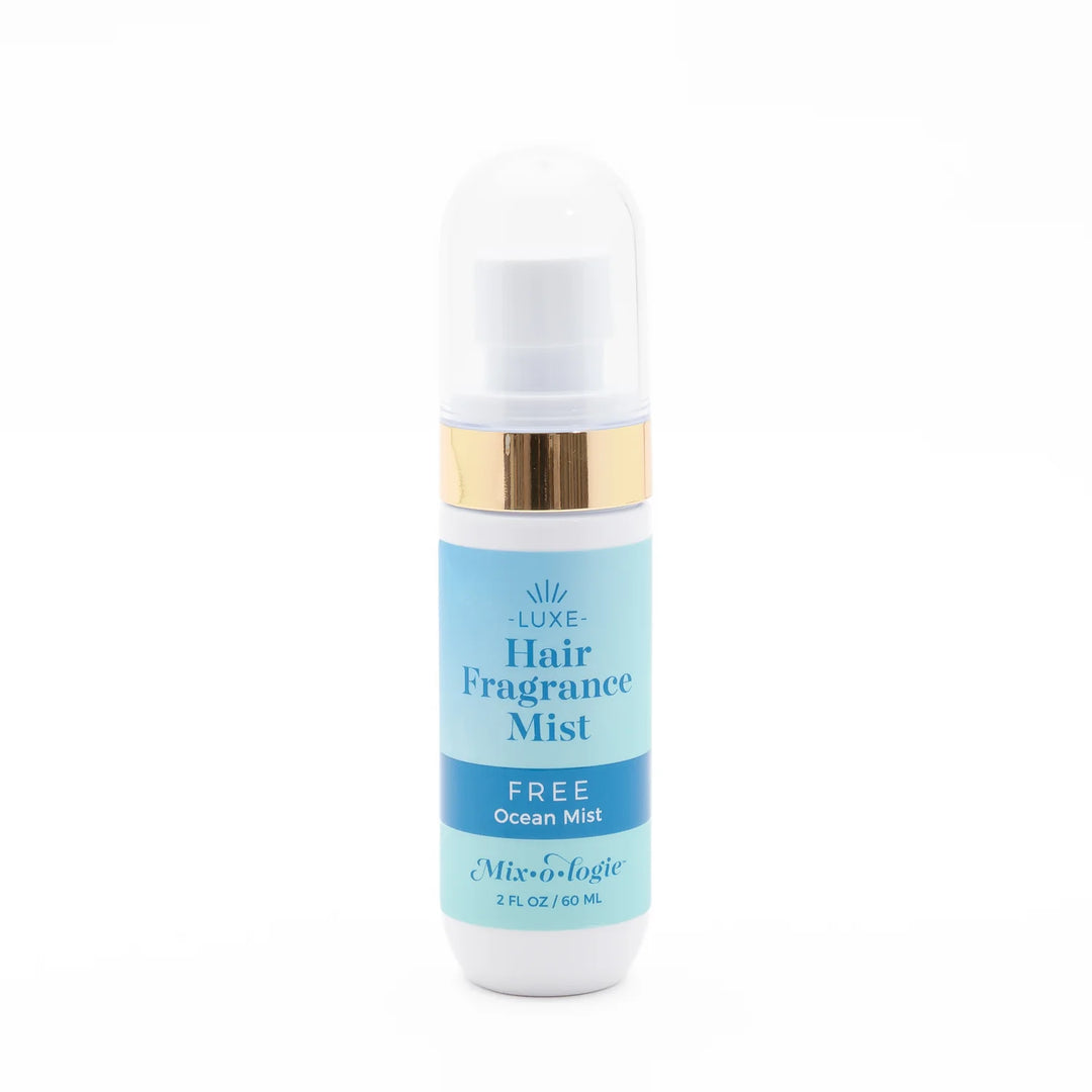 White and gold "Mix O Logie Hair Mist | Free (Ocean Mist)," 2 fl oz (60 ml), light blue label, clear cap, alcohol-free.