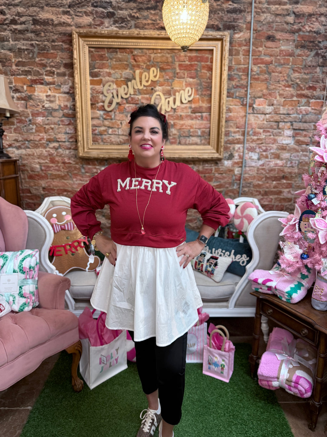 Twyla Red Merry Dress with long sleeves, sequin “MERRY” design, and white flared skirt overlay. Sizes XS-3XL.