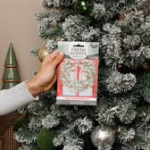 Package of Red Door Wreath Scented Sachet; available in small and large sizes.