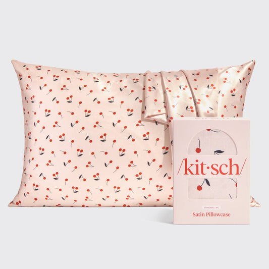 Satin pillowcase with light pink background and small red cherries, helps reduce breakage; available in standard size.