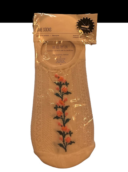 These woman's socks have a silicone tab and a silicone pad they're white with floral design
