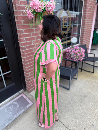 The Palace Palm Marisol Caftan is a maxi dress with bold pink and green stripes. Available in sizes XS–XL.