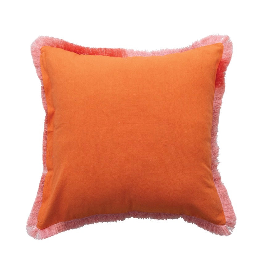 Square orange velvet pillow with light pink fringe trim. Available sizes: 18″x18″, 20″x20″.