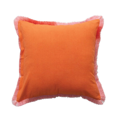 Square orange velvet pillow with light pink fringe trim. Available sizes: 18″x18″, 20″x20″.