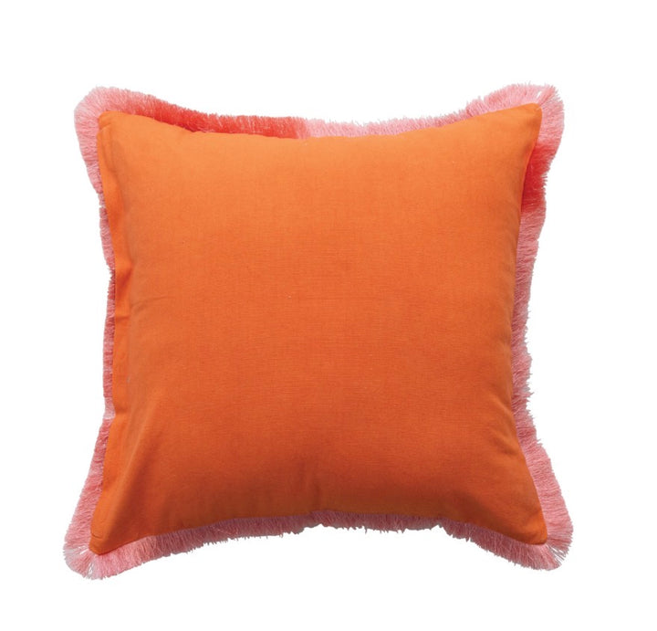 Square orange velvet pillow with light pink fringe trim. Available sizes: 18″x18″, 20″x20″.