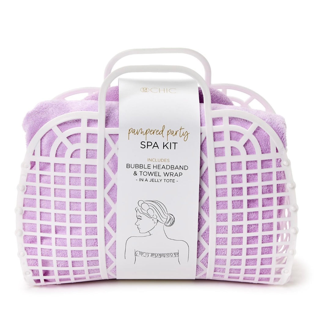 Purple headband and wrap towel inside a white tote for on-the-go.