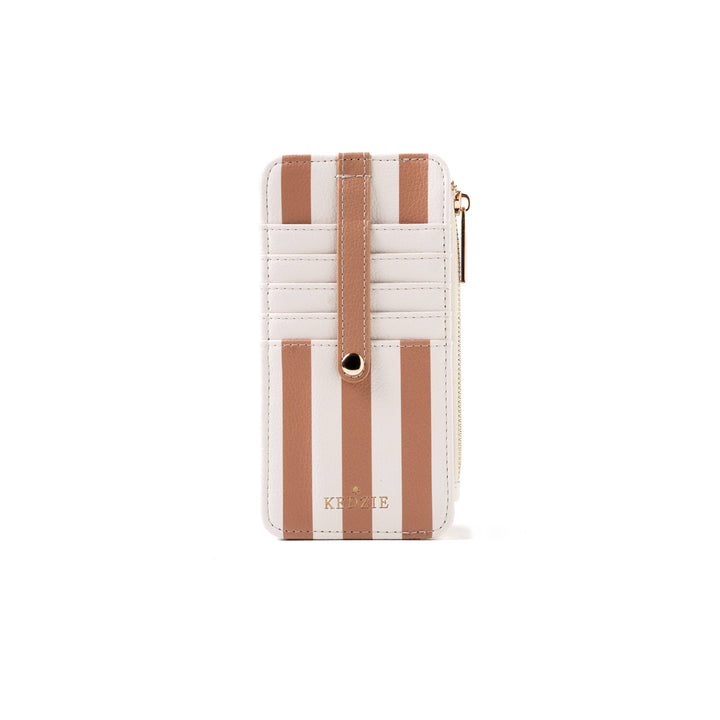 Beige and white vertically striped vegan leather cardholder with snap strap, zippered side, and gold “KEDZIE” logo at the bottom. Available in standard size.
