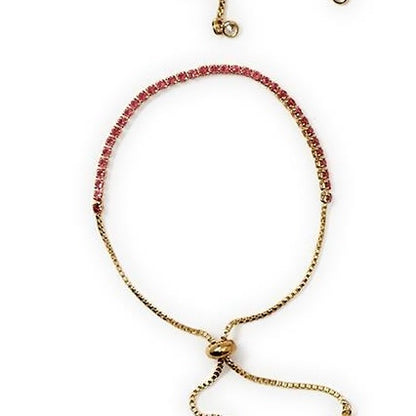 Delicate gold adjustable bracelet with pink gemstones, sliding clasp, chain ends. Available sizes: S, M, L.