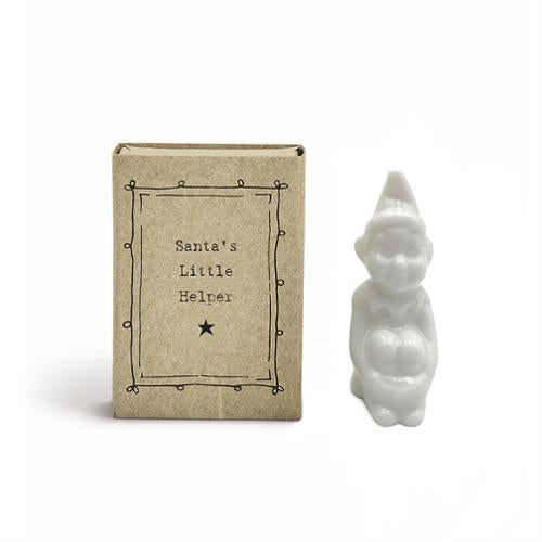 Small cardboard matchbox from the East of India Littles Christmas collection labeled “Santa’s Little Helper.”.