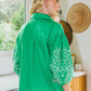 The Kelly Embroidered Balloon Sleeve Button Down Shirt features white leaf patterns on its sleeves. Available sizes: XS, S, M, L, XL.