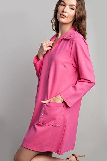 Jewel Detail Pocket Mini Dress with long sleeves, collared neckline, jeweled front pocket. Available in sizes XS-XL.