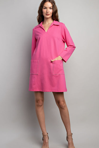 Jewel Detail Pocket Mini Dress with long sleeves, collared neckline, jewel-accented front pockets. Sizes: XS-XL.