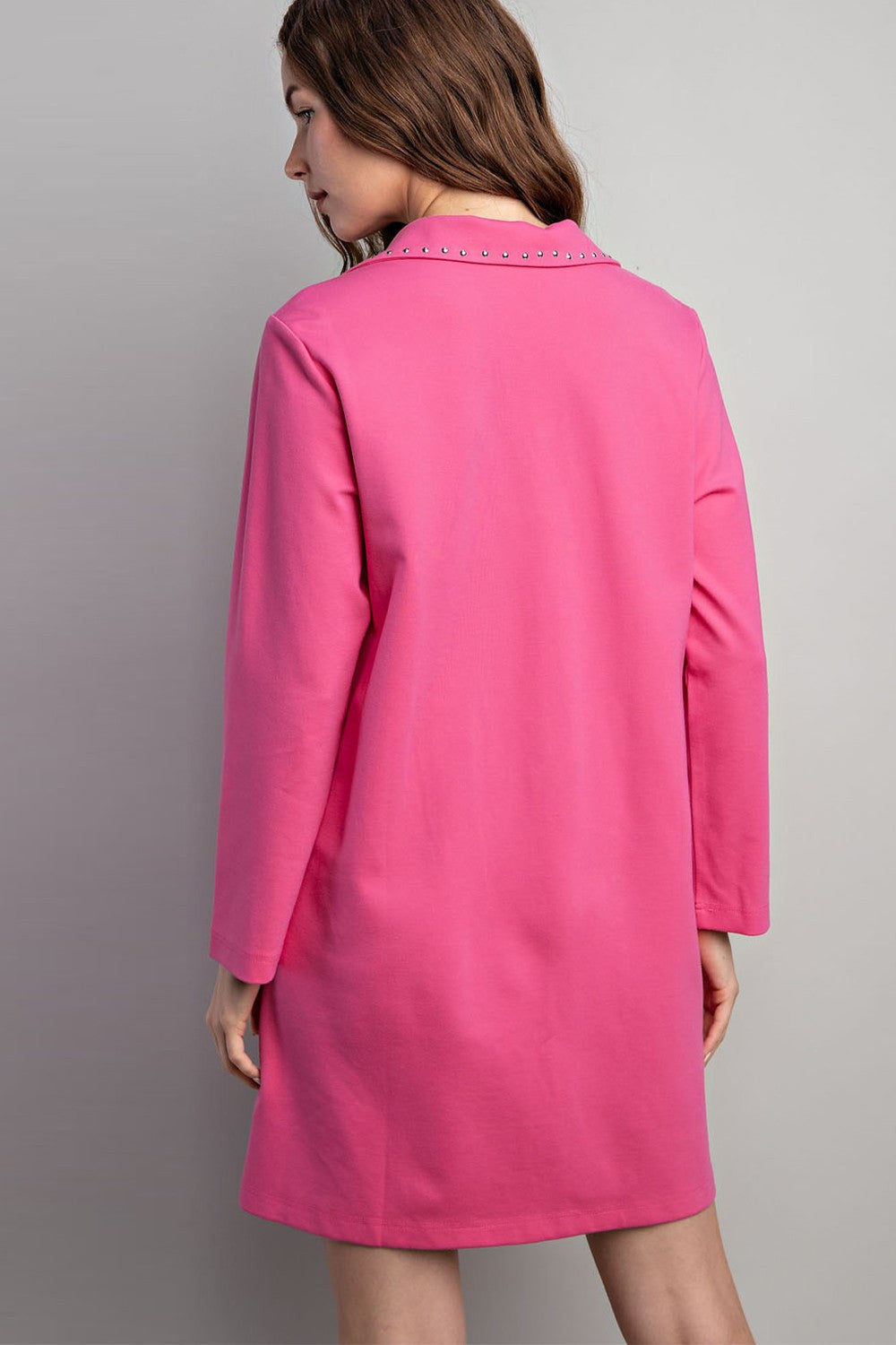 Bright pink mini dress with long sleeves, collared neckline, jewel stud accents. Available in sizes XS-XL.