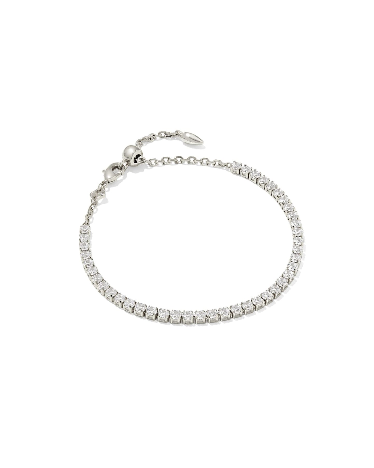 Delicate silver tennis bracelet with white CZ stones, adjustable chain, bead clasp. Available sizes: S, M, L.