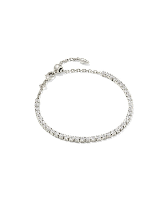 Delicate silver tennis bracelet with white CZ stones, adjustable chain, bead clasp. Available sizes: S, M, L.