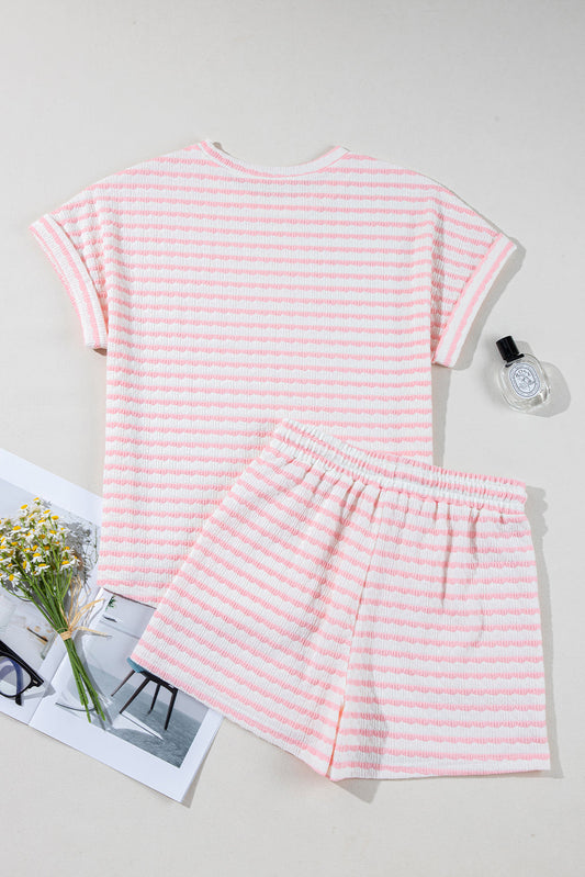 The Milana Stripe Knitted Set features a short-sleeved pink and white striped top and matching drawstring shorts. Sizes available: S, M, L.