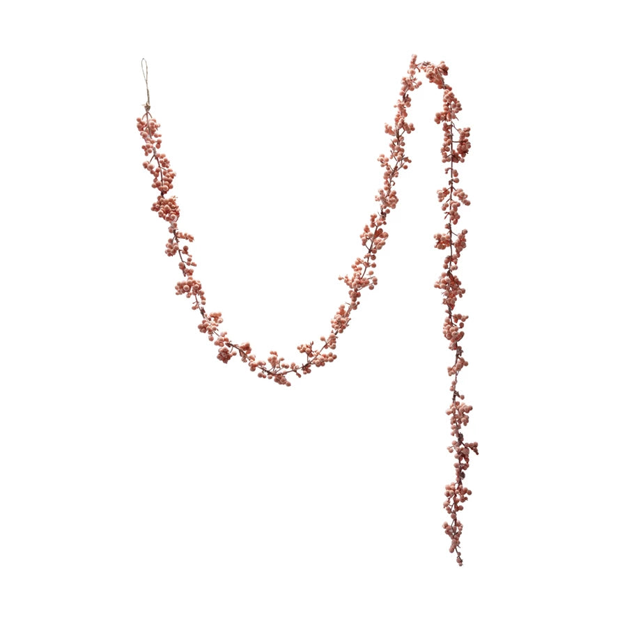 Pink flocked foam ball garland on a wire strand.