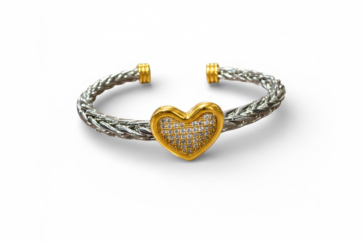 Twisted Silver Heart Bangle: silver braided cuff, gold accents, diamond-studded gold heart. Available in S, M, L.