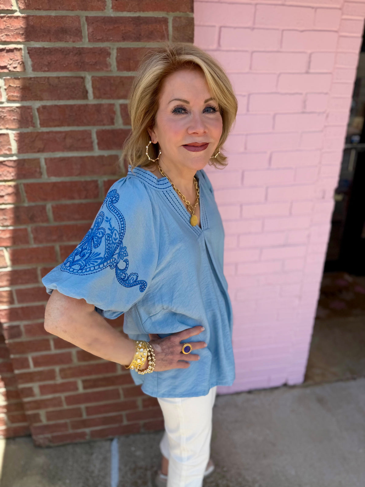 Light Blue Embroidered Puff Sleeve Top. Available in sizes XS–XL.
