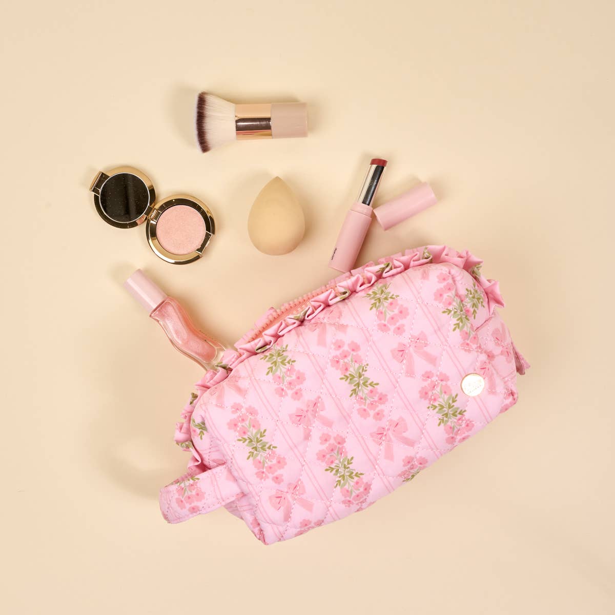 The Essentials Quilted Cosmetic Pouch–Oh So Fancy Pink with floral quilted design, wipeable lining, zipper. Sizes available.