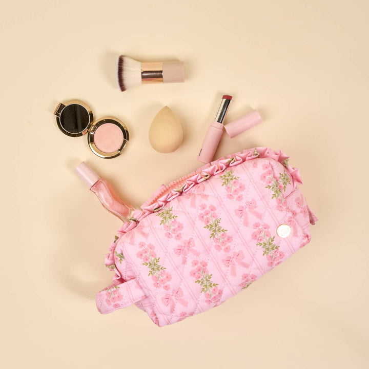 The Essentials Quilted Cosmetic Pouch–Oh So Fancy Pink with floral quilted design, wipeable lining, zipper. Sizes available.
