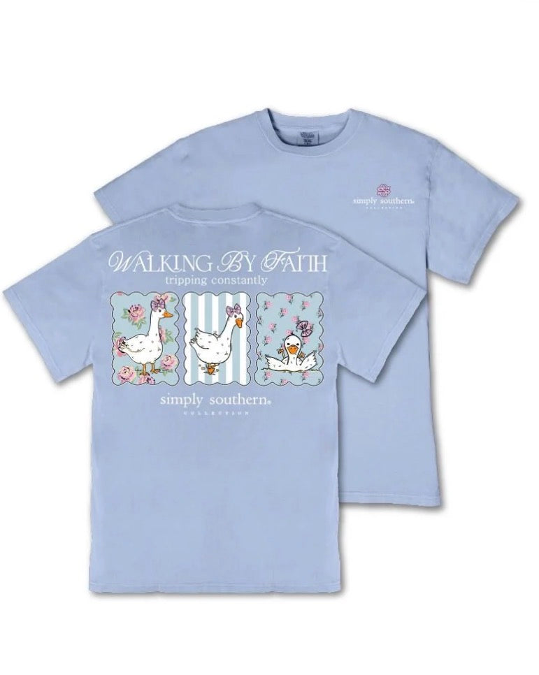 Light blue t-shirt featuring playful geese illustrations and the phrase “WALKING BY FAITH tripping constantly” on the back, with Simply Southern logo on the left chest. Available in sizes S-XXL.
