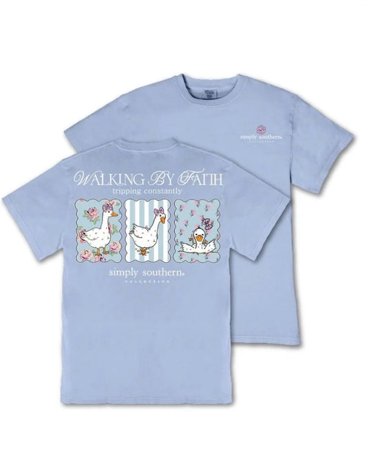 Light blue t-shirt featuring playful geese illustrations and the phrase “WALKING BY FAITH tripping constantly” on the back, with Simply Southern logo on the left chest. Available in sizes S-XXL.