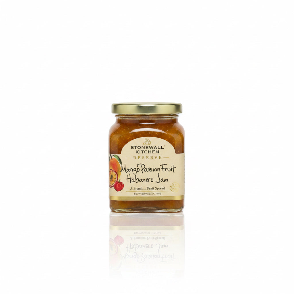 Jar of Reserve Mango Passionfruit Habanero Jam with gold lid and illustrated fruit label, available in multiple sizes. Sweet and spicy flavor.