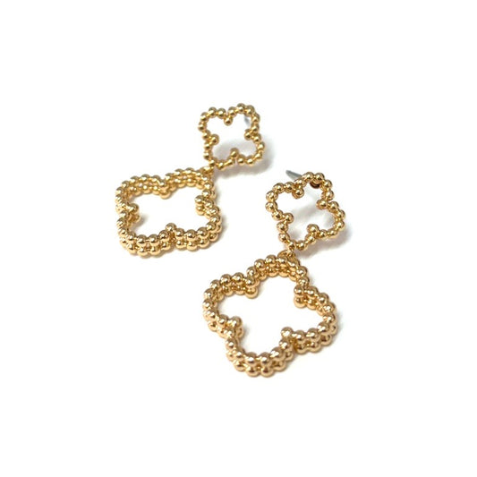 Stork Gold Earrings by Meghan Browne: two linked gold-tone flower outlines, small and large. Sizes available: small, large.