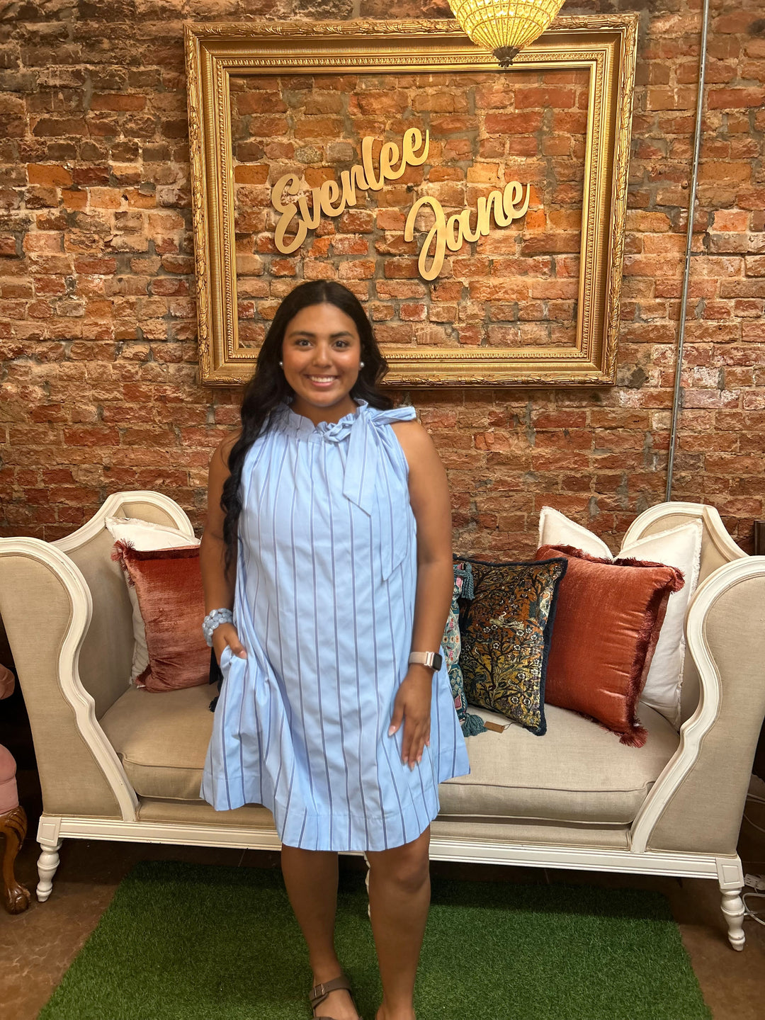 Pinstripe blue tie-neck sleeveless dress. Sizes available: XS–XL.