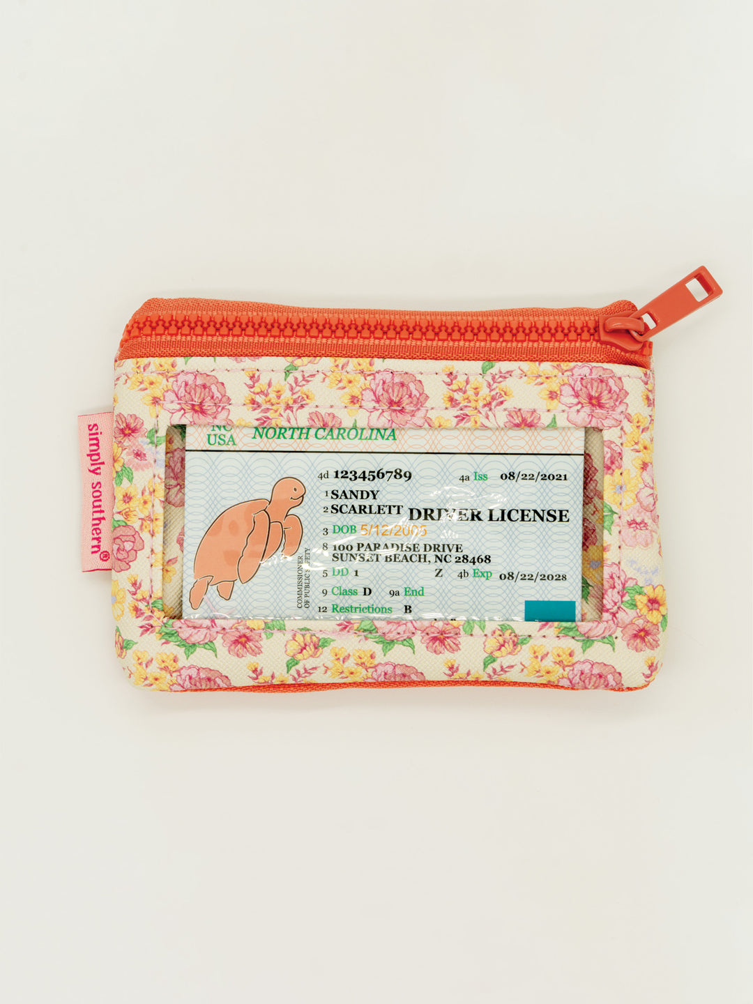 Compact key chain wallet with zippered pockets, clear ID window, pink zipper, keyring, Simply Southern tag. Sizes: not specified.