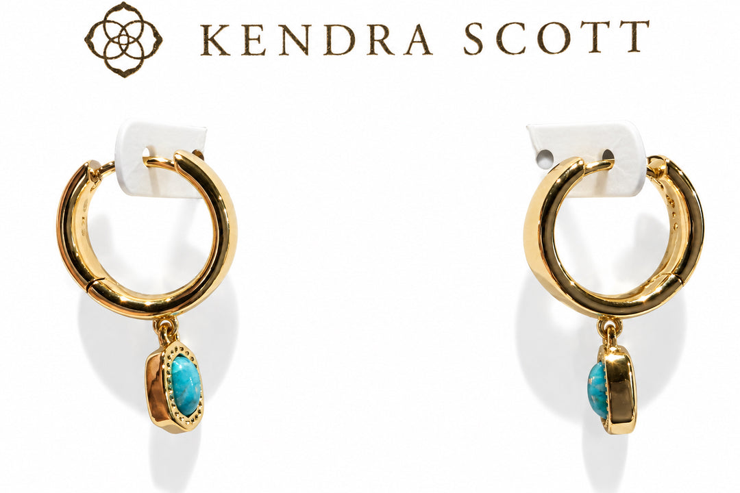 Gold huggie earrings with blue lab grown opal dangles, inspired by the Mini Ellie Wide Huggie design. Available in one size.