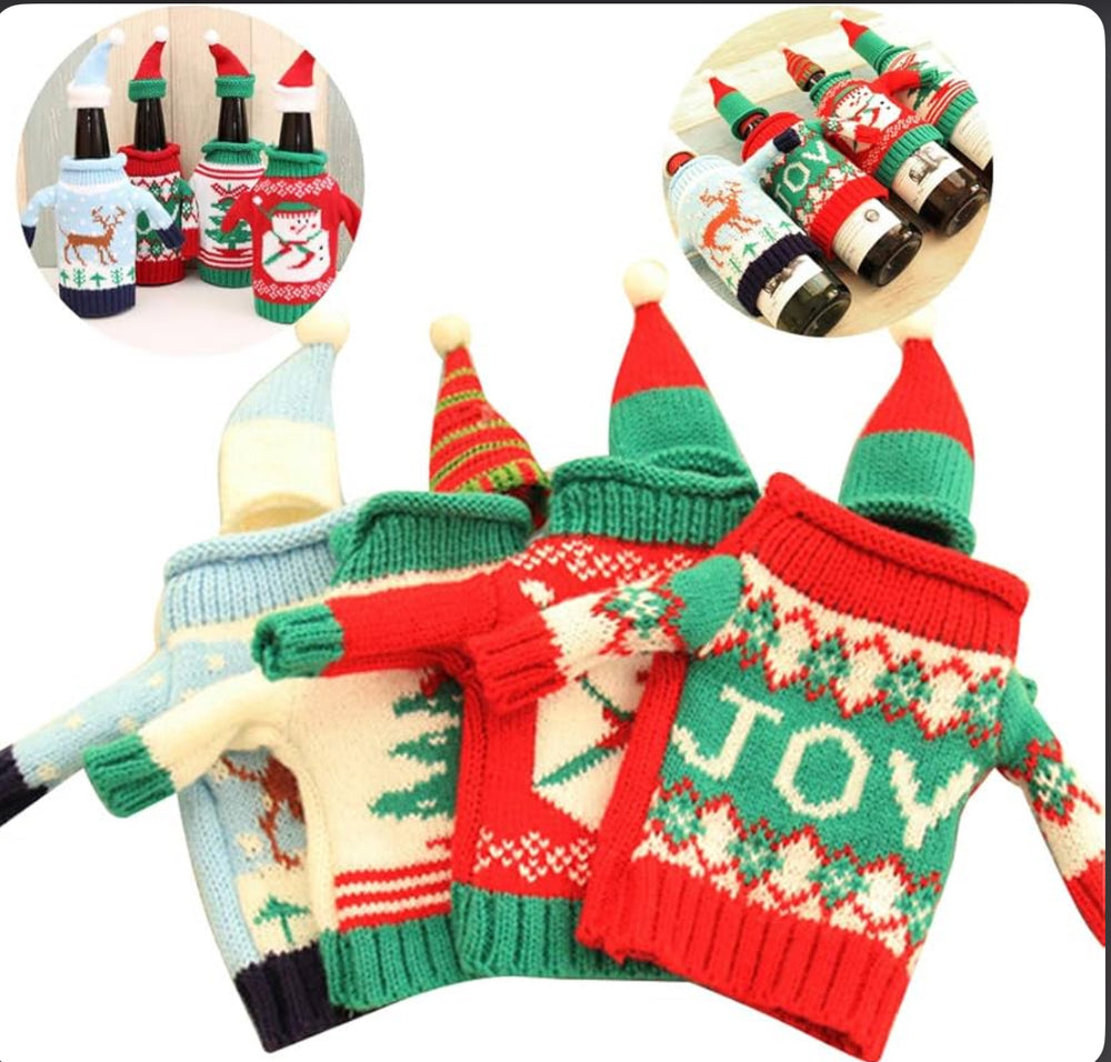 Four miniature holiday sweaters and matching pointed wine bottle hats with reindeer, Christmas tree, and “JOY” patterns.