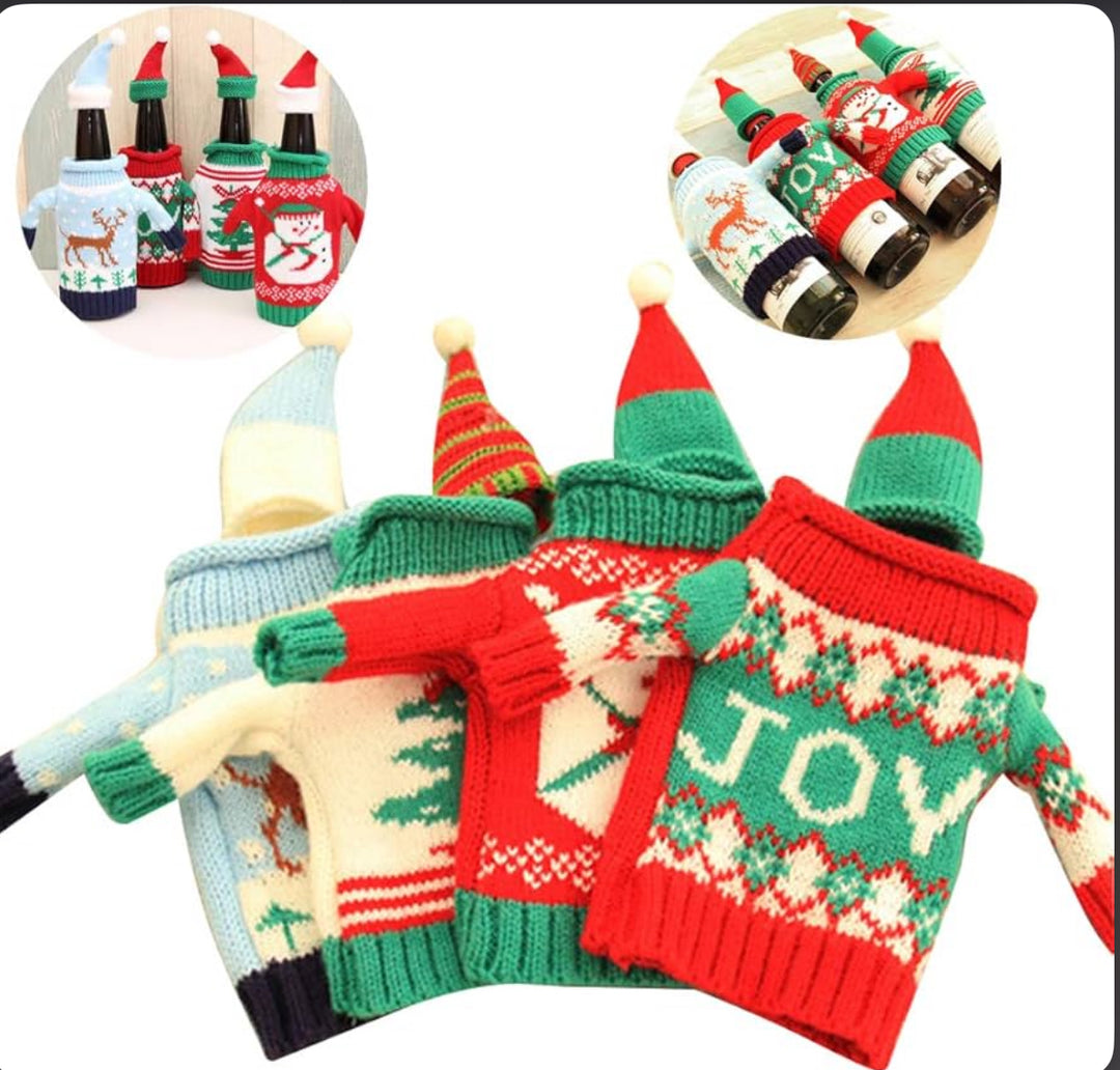 Four miniature holiday sweaters and matching pointed wine bottle hats with reindeer, Christmas tree, and “JOY” patterns.