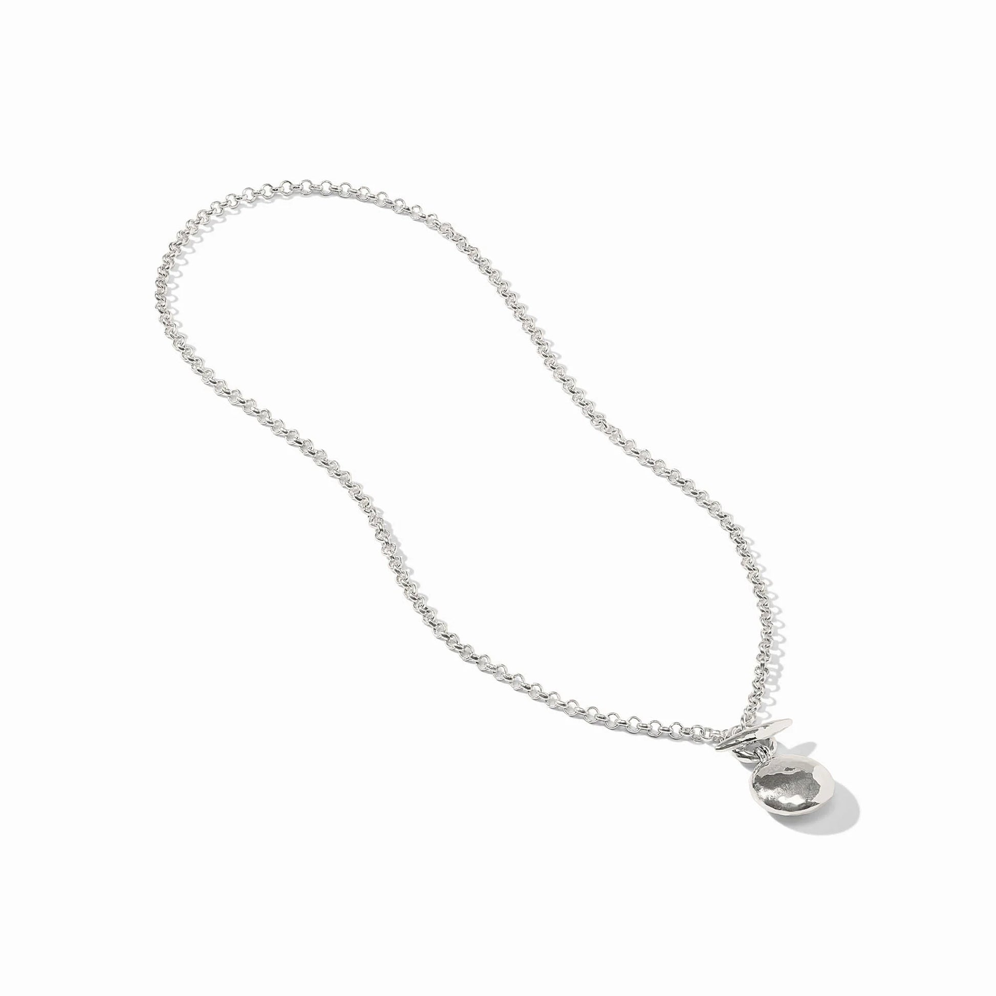 The Solara Delicate Necklace by Julie Vos features a pure silver plate chain with a textured round pendant and a small bow. Sizes available: 16", 18".