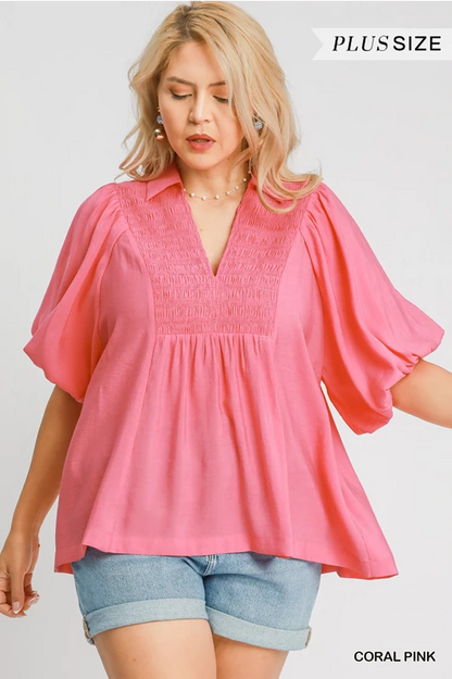 Maggie Bubble Sleeve Top in coral pink, short-sleeve, smocked V-neck. Available in plus sizes.