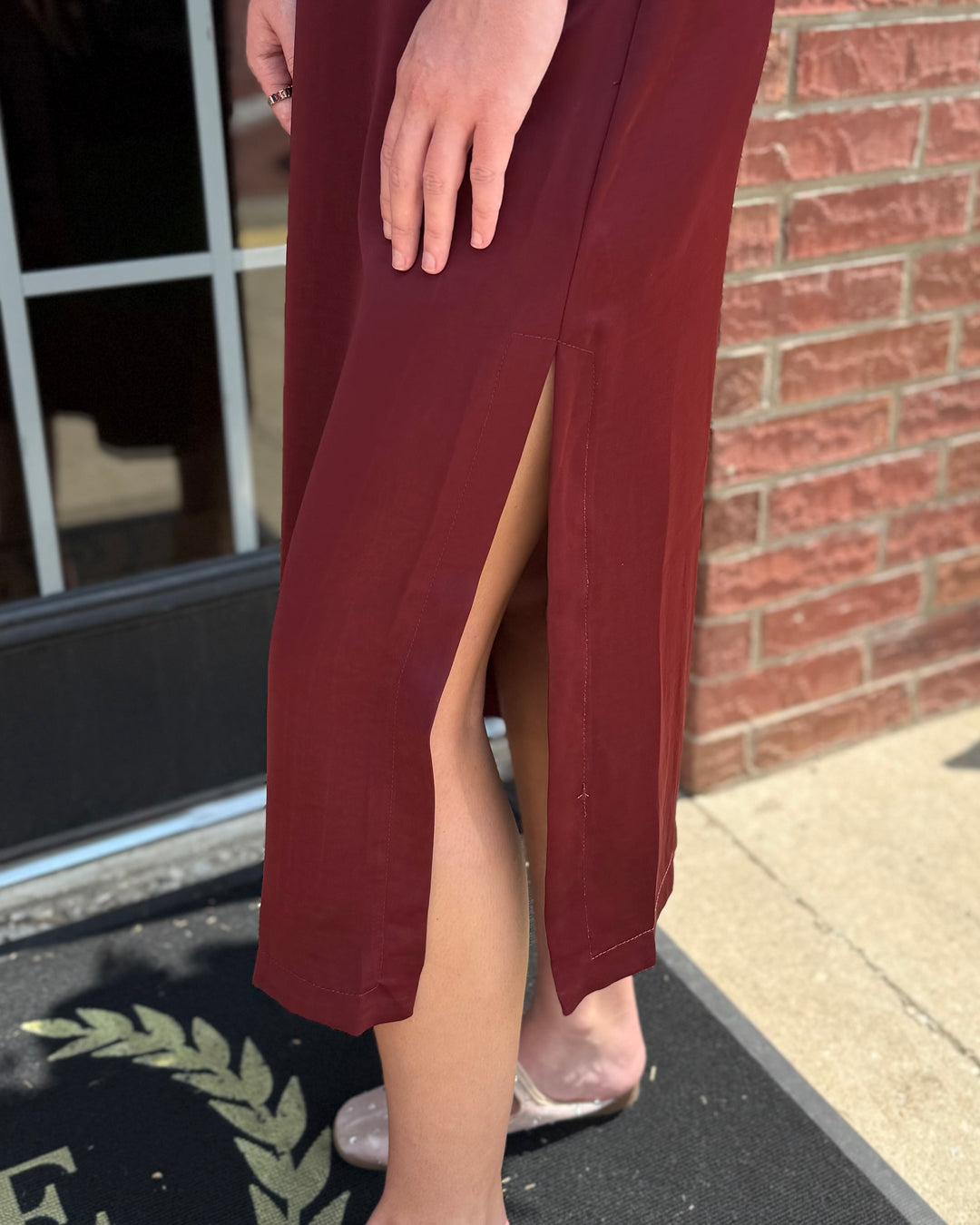 Satin Tie Back Midi Dress in burgundy with a high slit. Available in sizes XS-XL.