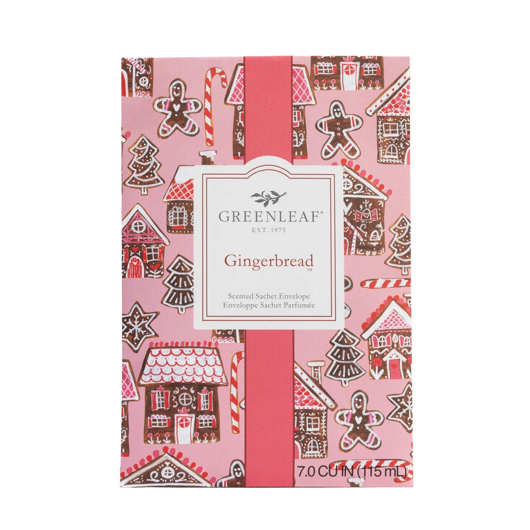 Gingerbread sachet with a pink gingerbread house, candy cane, and cookie pattern, central label, and 115 ml volume.
